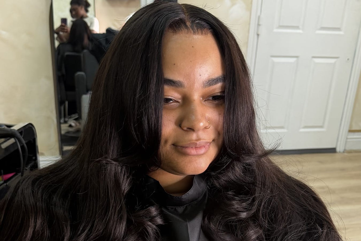 A finished body wave install with a side part